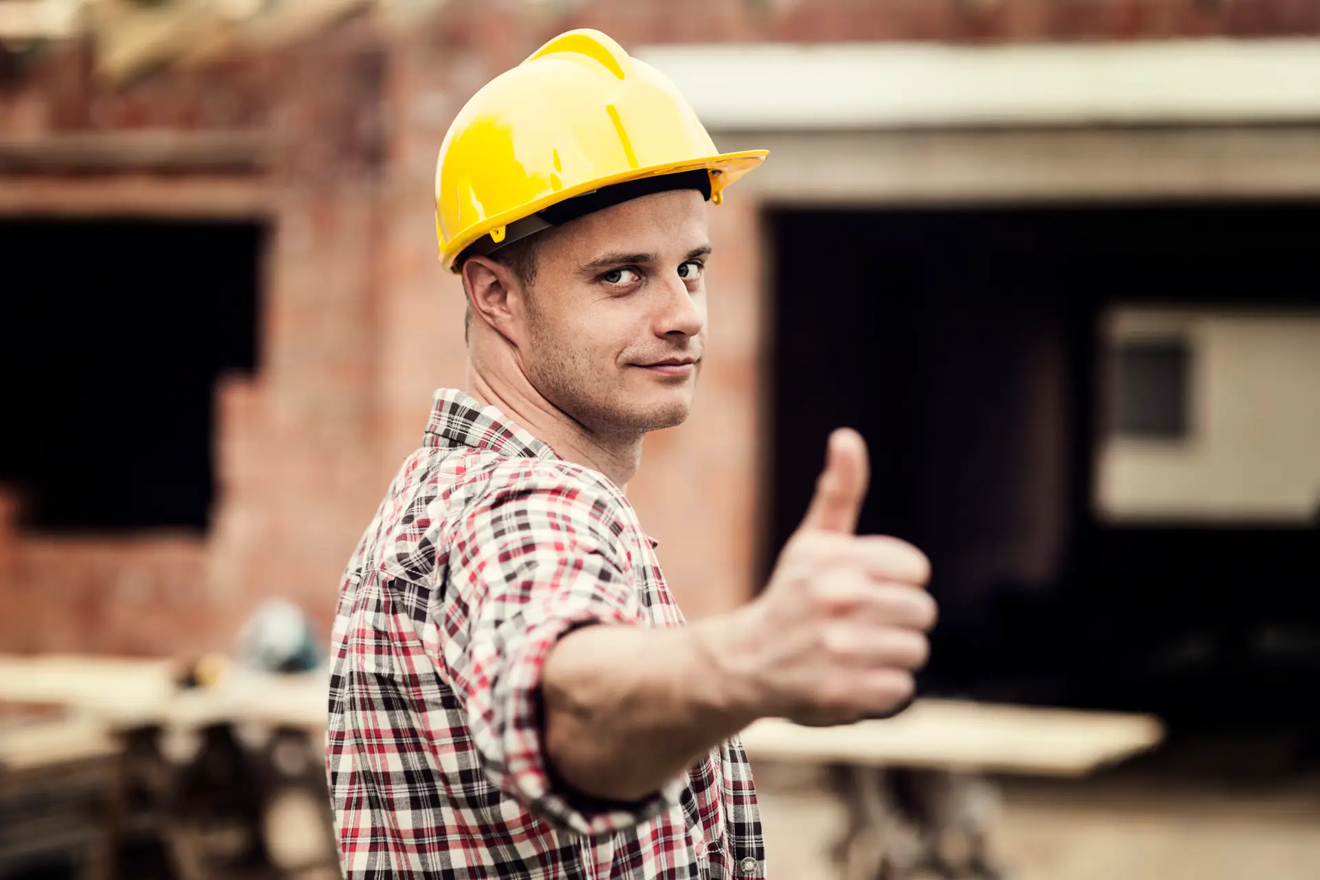 construction worker gesturing thumbs up